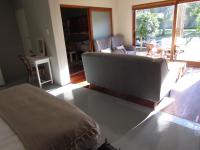 a bedroom with a couch and a living room at Caledon 31 in George