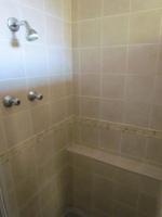 a bathroom with a shower with a shower head at Caledon 31 in George