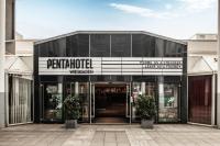 a building with a sign for a store at pentahotel Wiesbaden in Wiesbaden