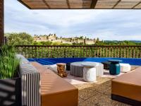 a patio with a view of a castle at Tribe Carcassonne in Carcassonne