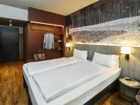 Ένα ή περισσότερα κρεβάτια σε δωμάτιο στο Ibis Styles Singen