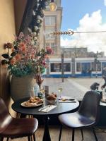 a table with plates of food on it with a train at Swissôtel Amsterdam in Amsterdam