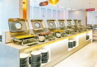 a buffet line with plates and bowls of food at Sokcho Mari Vista Hotel in Sokcho
