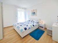 Posteľ alebo postele v izbe v ubytovaní Apartments Garden Residence Opatija