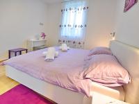 Posteľ alebo postele v izbe v ubytovaní Apartments Garden Residence Opatija