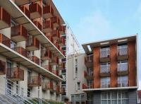 an external view of an apartment building with balconies at Séjours &amp; Affaires Paris Ivry in Ivry-sur-Seine
