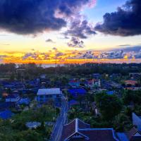 a view of a city at sunset at Happy Place Official in Nai Yang Beach