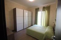 A bed or beds in a room at Appartamenti Colombo