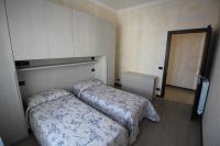 A bed or beds in a room at Appartamenti Colombo