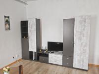 a living room with a flat screen tv on a wall at Apartmány Pražská in Ústí nad Labem
