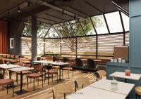 een restaurant met tafels, stoelen en ramen bij ibis Styles Colombes Paris Ouest (Ouverture Octobre 2025) in Colombes