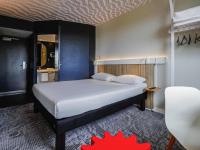 Ένα ή περισσότερα κρεβάτια σε δωμάτιο στο Ibis Luxembourg Airport
