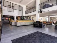 a lobby with a piano in the center of a store at ibis Dijon Sud in Perrigny-lès-Dijon