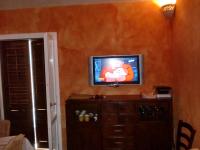 A television and/or entertainment centre at Favignana Margot House