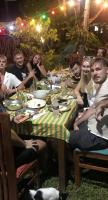 a group of people sitting around a dinner table at Villa Claudia Nimal's kitchen in Ahangama