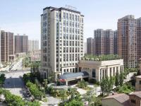 太原市にあるPullman Taiyuanの高層建築の都市の白い大きな建物