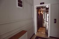 a hallway with a door leading into a room at C&C Residence Hotel in Bacău