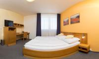 Postel nebo postele na pokoji v ubytování Hotel Trend