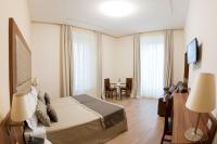 A bed or beds in a room at Navona Luxury Guesthouse