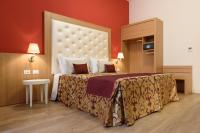 A bed or beds in a room at Navona Luxury Guesthouse