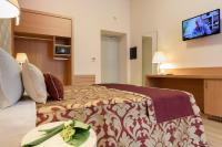 A television and/or entertainment centre at Navona Luxury Guesthouse