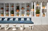 a room with a table with pillows and potted plants at Delamar 4*Sup-Adults only (18+) in Lloret de Mar