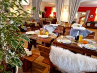 a dining room with couches and a table with food at Kamionki in Sosnowiec