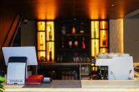 a bar with a counter with a phone on it at The Hush Nepal in Kathmandu