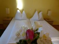 Postel nebo postele na pokoji v ubytování Hotel Fischachstubn