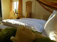Postel nebo postele na pokoji v ubytování Hotel Fischachstubn