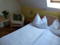 Postel nebo postele na pokoji v ubytování Hotel Fischachstubn