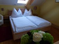 Postel nebo postele na pokoji v ubytování Hotel Fischachstubn