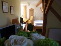 Postel nebo postele na pokoji v ubytování Hotel Fischachstubn