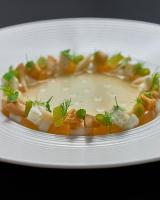 a white plate of food with a bowl of soup at Garden Suites - Duinhotel in Burgh-Haamstede zeeland in Burgh Haamstede