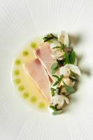 a plate of food with a piece of meat and vegetables at Garden Suites - Duinhotel in Burgh-Haamstede zeeland in Burgh Haamstede