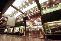 a store front of a building with a sign on it at The Enterpriser Hotel in Taichung