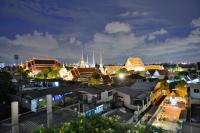 a city skyline at night with buildings and mosques at Riva Arun Bangkok in Bangkok