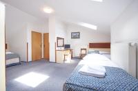 Postel nebo postele na pokoji v ubytování Hotel Atos