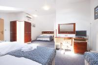 Postel nebo postele na pokoji v ubytování Hotel Atos