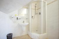 Koupelna v ubytování Hotel Atos