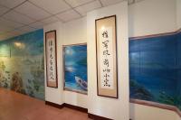 a room with paintings on the walls of a building at Love in Hualien B&amp;B in Hualien City