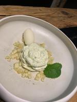 een wit bord met slagroom en een ei erop bij La Noccemada, maison d'hôtes in Saint-Julien