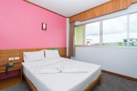 Postel nebo postele na pokoji v ubytování Riverside Hotel
