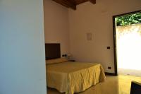 A bed or beds in a room at Agriturismo San Martino