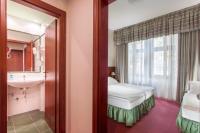 Łóżko lub łóżka w pokoju w obiekcie Hotel Lunik