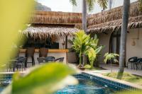a resort with a swimming pool and a bar at TALI BOUTIQUE Hotel in Ao Nang Beach