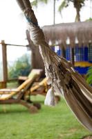 a close up of a hammock in a park at Pousada DiMari in Boicucanga