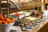 a buffet line with many different types of food at СПА апартамент "Цвети" в Балнео хотел "Свети Спас" - Минерална вода,гледка и уют in Velingrad