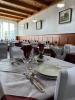 A restaurant or other place to eat at La Rosa di Novaggio - Pensione & Zimmer