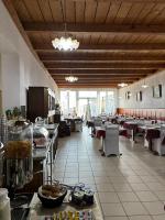 A restaurant or other place to eat at La Rosa di Novaggio - Pensione & Zimmer